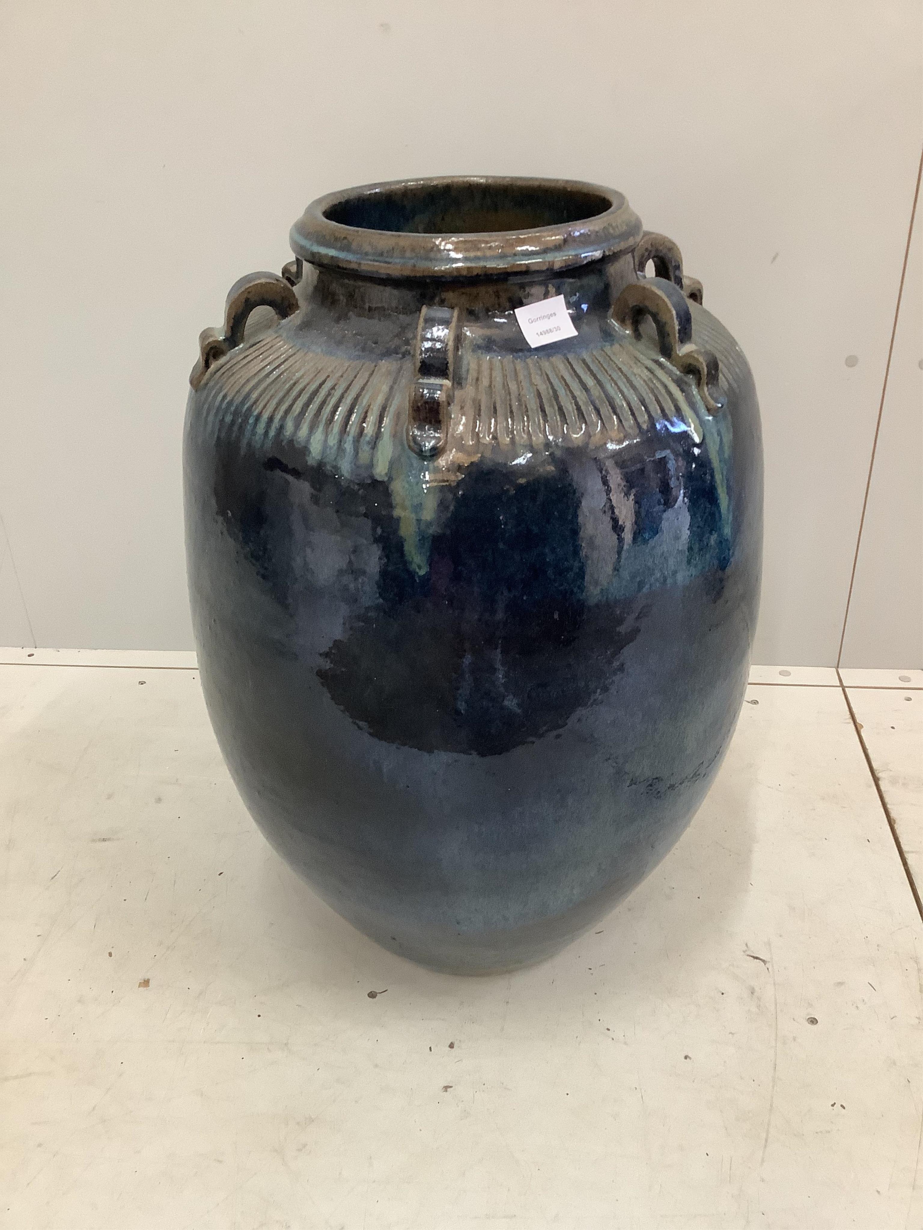 Monica Young (1929-2004), a large blue glazed earthenware vase, the neck applied with six ring handles, impressed studio mark, height 75cm. Condition - good